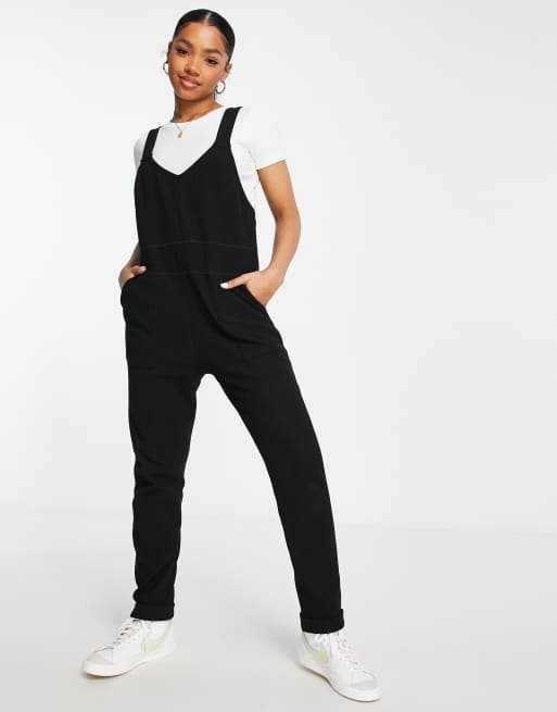 ASOS DESIGN - Ribstrikkede overalls med bindebånd i sort i slim fit 