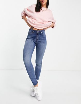 ASOS DESIGN – Ridley – Enge Jeans mit hohem Bund in mittelblauer Authentic-Waschung
