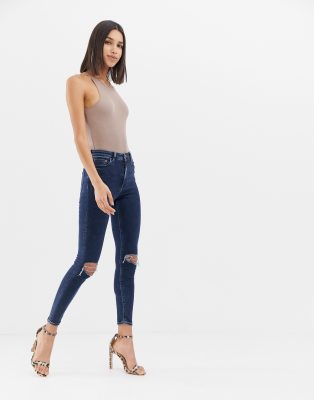 Ridley high waist skinny jeans in deep blue wash with busted knees