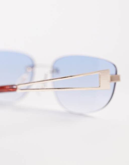 ASOS DESIGN rimless rectangle sunglasses in gold metal with blue lens, 2 of 3