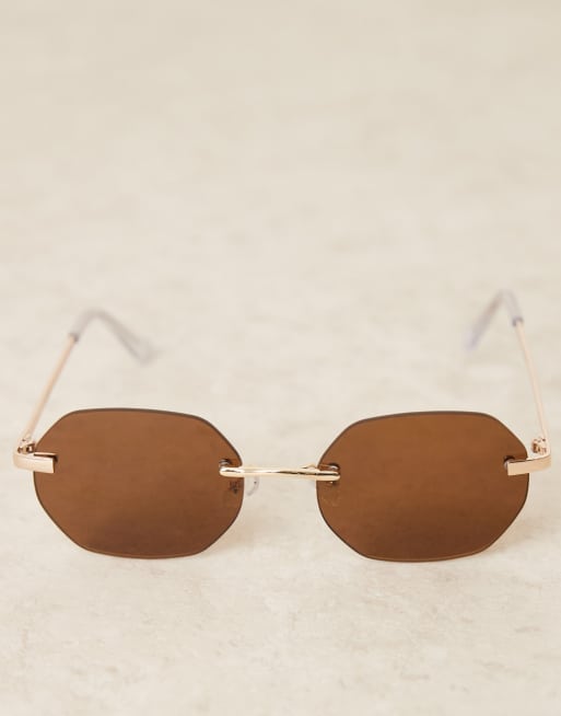 ASOS DESIGN rimless sunglasses with brown round lenses and metal gold frame , 2 of 3