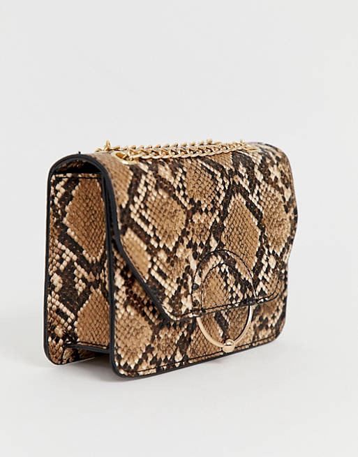 ASOS DESIGN ring and ball cross body bag with chain strap in snake