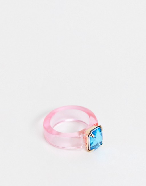 ASOS DESIGN ring in pink plastic with blue crystal