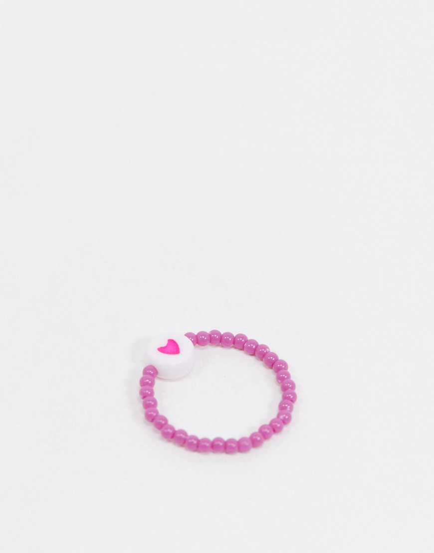 ASOS DESIGN ring with heart stretch bead design in pink