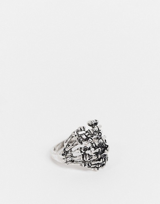 ASOS DESIGN ring with skeleton hands in burnished silver tone