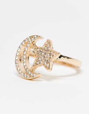 ring with star and moon design in gold tone