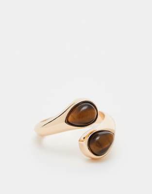 ring with wraparound design and real semi precious tigers eye in gold tone