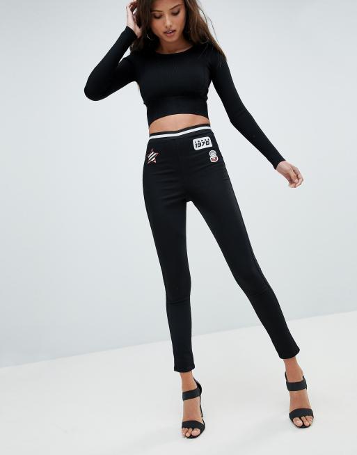 ASOS DESIGN Rivington high waist denim jeggings in clean black with logo  print detail