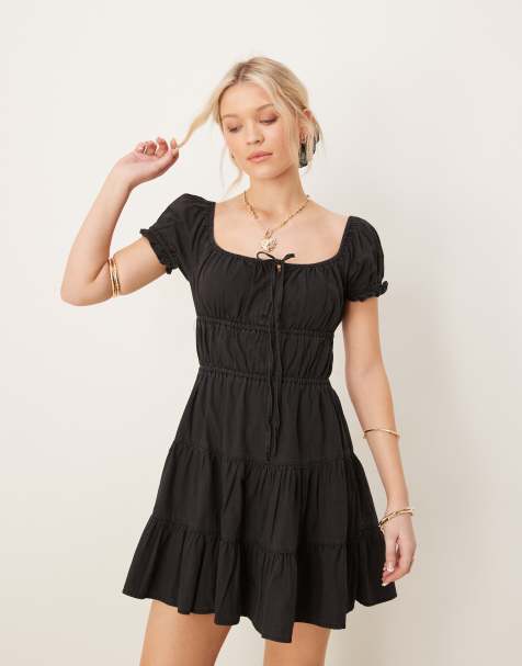ASOS DESIGN - Robe babydoll courte à volants étagés en jean souple avec liens à nouer - Noir - view 1