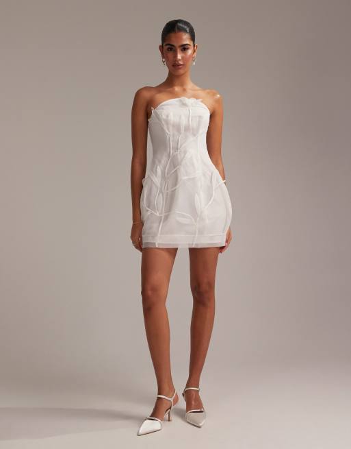 ASOS DESIGN bandeau mini dress with trailing 3D flowers in white