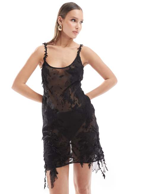 ASOS DESIGN - Robe courte à bretelles en dentelle transparente avec fleurs appliquées - Noir