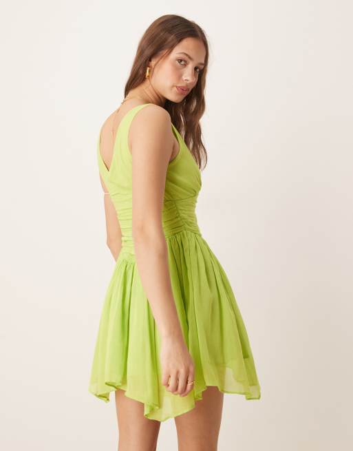 ASOS DESIGN V-neck mini dress with hanky hem in kiwi green