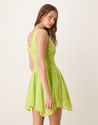 ASOS DESIGN V-neck mini dress with hanky hem in kiwi green