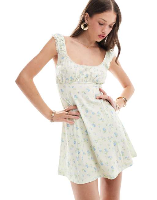 ASOS DESIGN - Robe courte virevoltante à fleurs en tissu texturé style années 90 