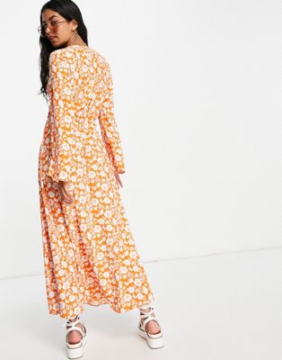 Robes mi-longues Design - Robe mi-longue nouée devant à imprimé fleuri style années 70