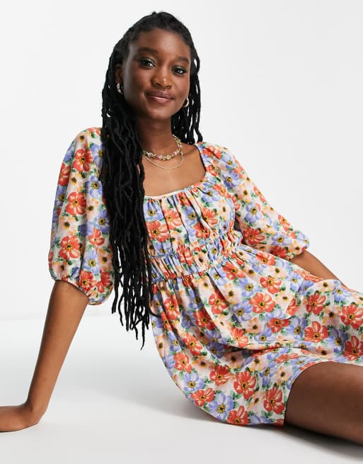 ASOS DESIGN - Robe patineuse courte avec buste froncé et manches bouffantes à imprimé floral vif