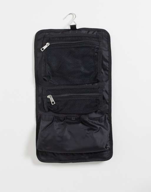 ASOS DESIGN roll toiletry bag with clip and hook in black ASOS