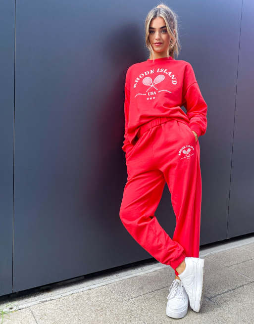 ASOS DESIGN roll waist oversized sweatpants with tennis logo in red