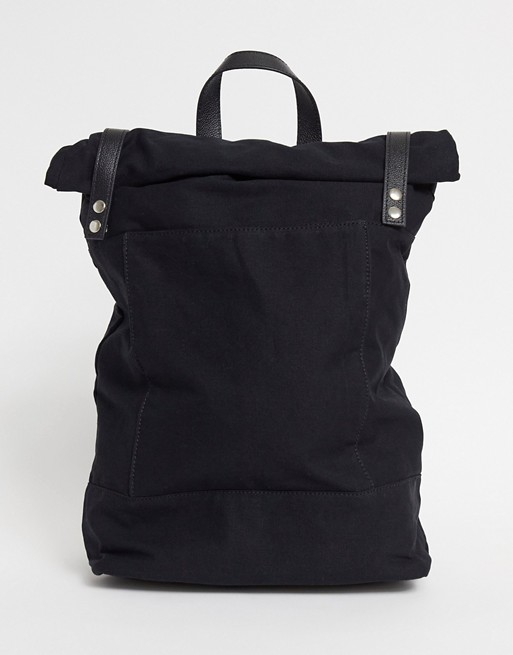 ASOS DESIGN rolltop backpack in black canvas with leather trims