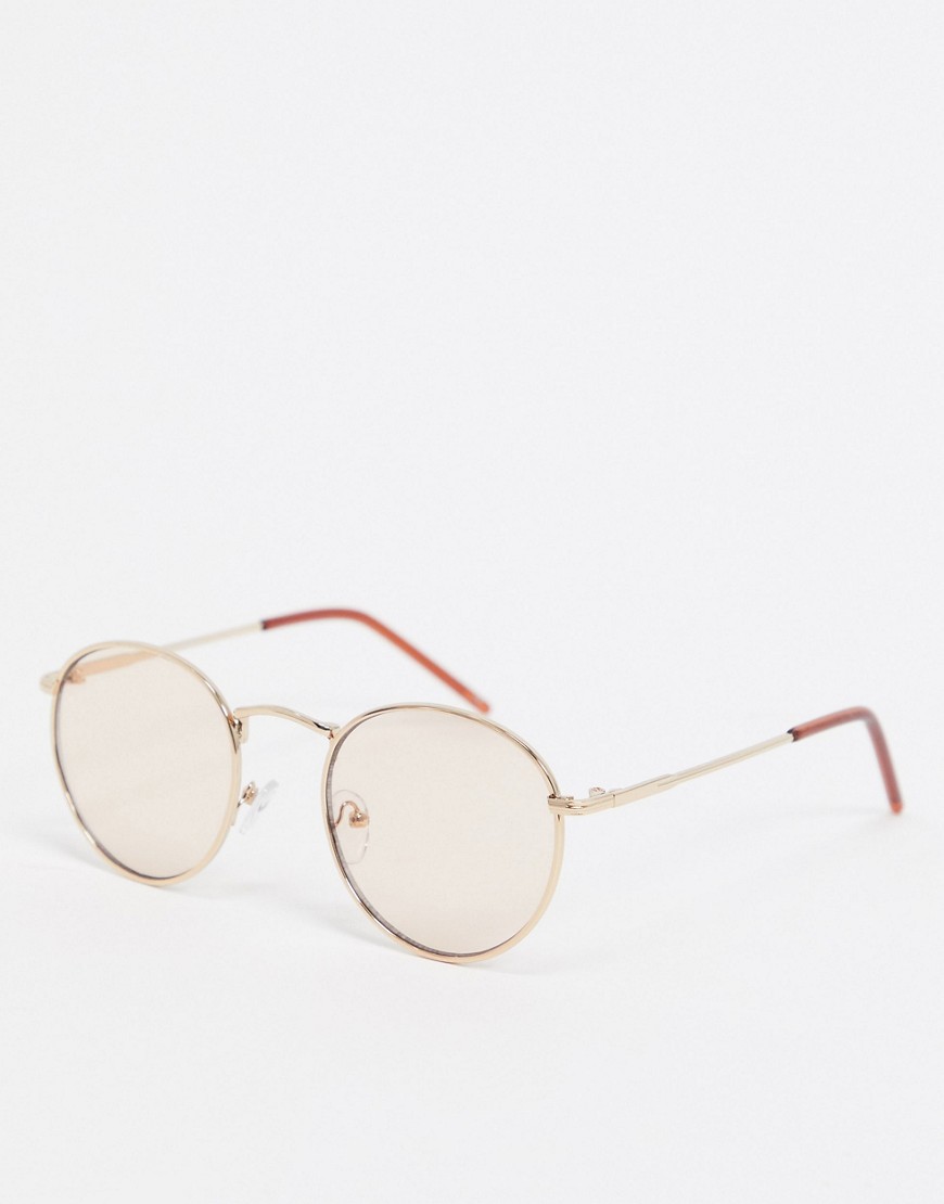 ASOS DESIGN round sunglasses in gold metal with tinted lens