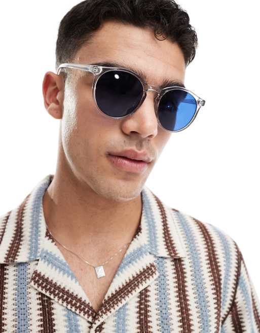 ASOS DESIGN round sunglasses with clear crystal frame and blue lens