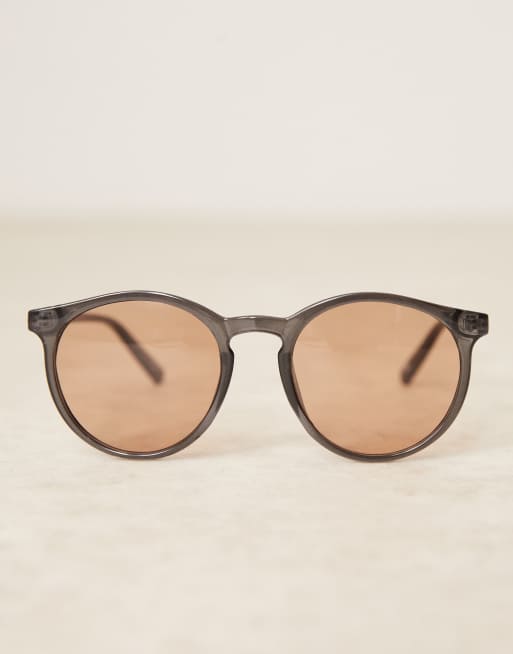 ASOS DESIGN round sunglasses with light brown lens and black crystal frame