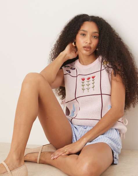 ASOS DESIGN crew neck knit tabard vest with floral embroidery in pink