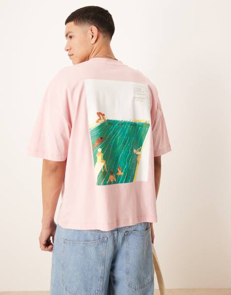 ASOS DESIGN boxy oversized t-shirt with dropped shoulder and sports graphic in pink
