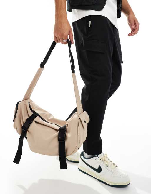 ASOS DESIGN rubberised cross body bag with pocket and buckle detail in beige, 2 of 4