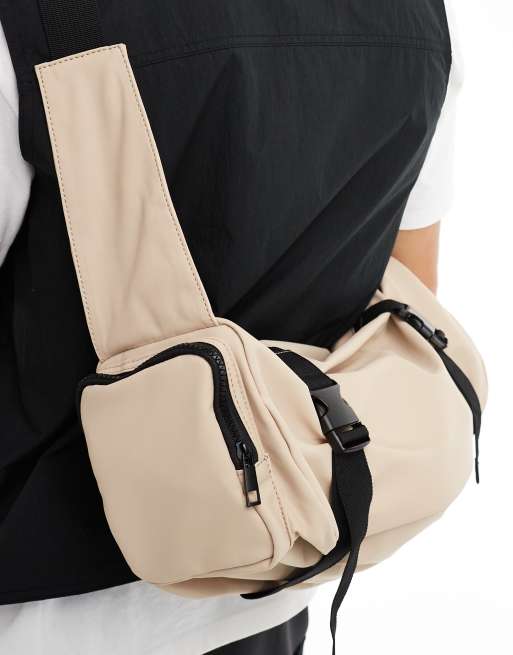 ASOS DESIGN rubberised cross body bag with pocket and buckle detail in beige, 3 of 4
