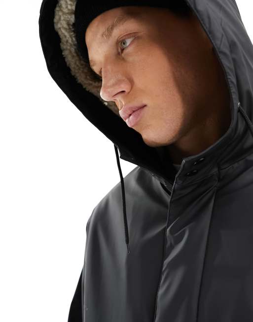 ASOS DESIGN rubberised rain jacket with borg lining in black