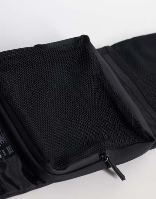 ASOS DESIGN rubberized foldover toiletries bag in black, 2 of 3