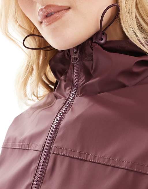 ASOS DESIGN rubberized rain coat in burgundy