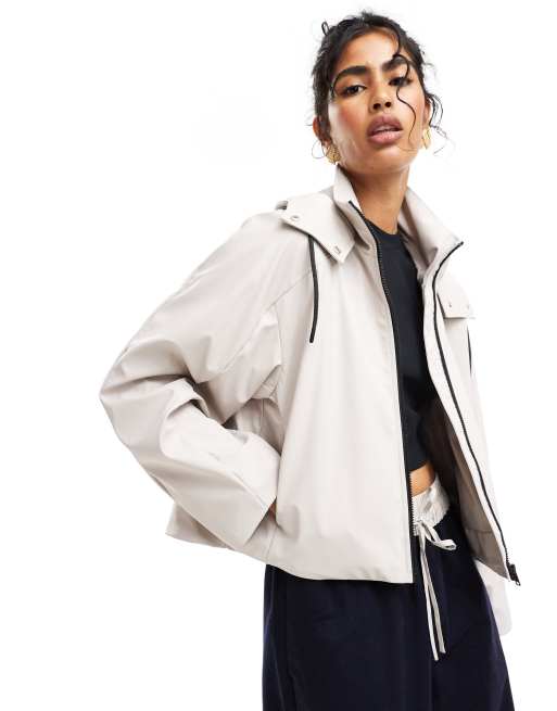 ASOS DESIGN rubberized throw on rain jacket with pocket detail in stone