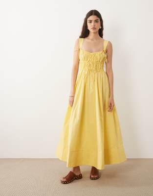 ASOS DESIGN ruched bodice maxi sundress with full skirt and multi stitched hem in yellow