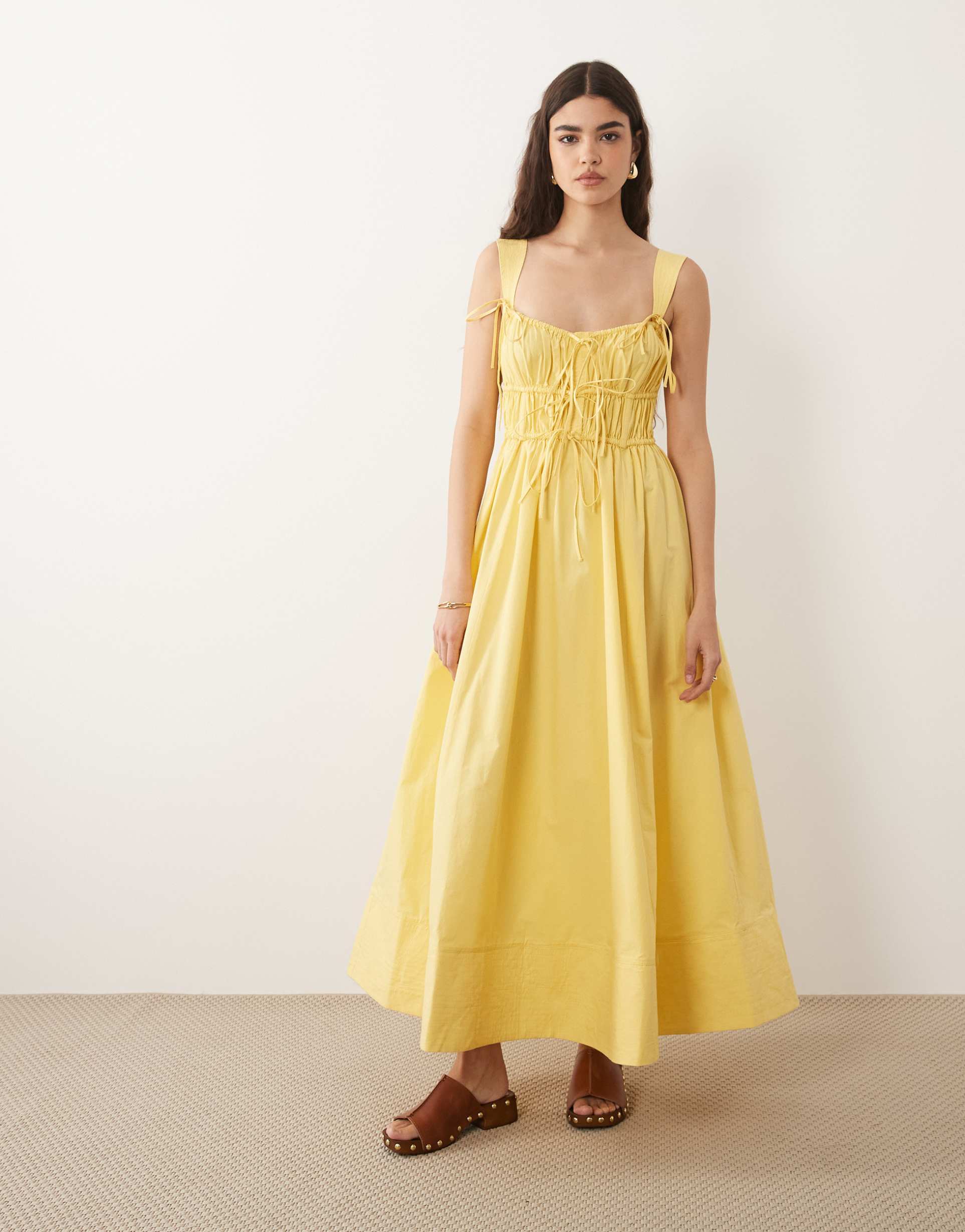 asos design ruched bodice maxi sundress with full skirt and multi stitched hem in yellow