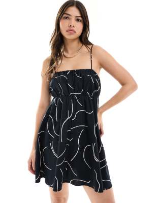 asos design ruched bust mini sundress with adjustable straps in mono abstract print