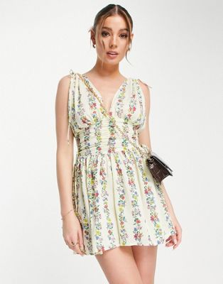 ASOS DESIGN ruched flippy playsuit in linear floral