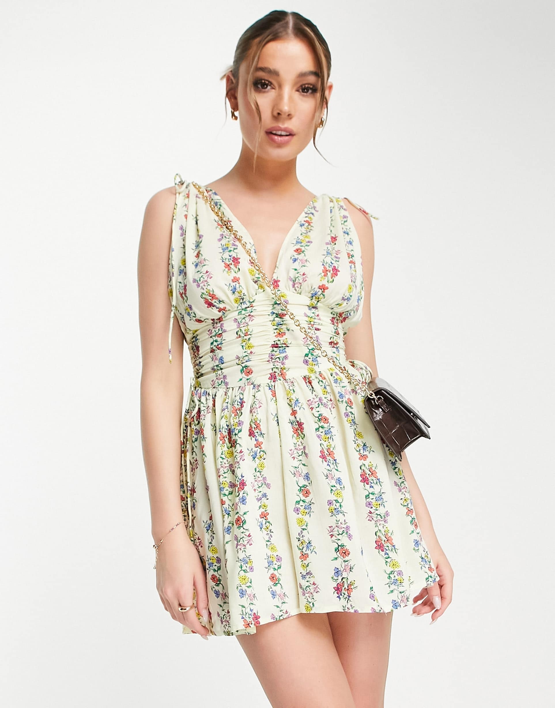 asos design ruched flippy romper in linear floral