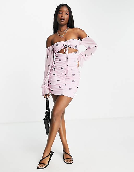 Women ruched mesh mini dress in pink and black heart print 