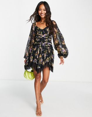 ASOS DESIGN ruched puff sleeve mini dress in black based floral