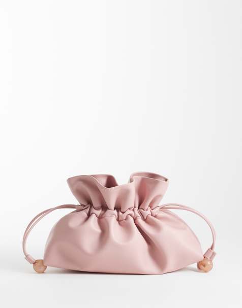ASOS DESIGN ruched resin ball pouch clutch bag with detachable shoulder strap in light pink - view 1