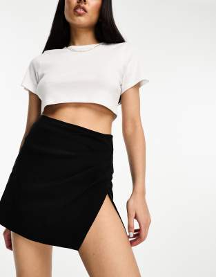 ASOS DESIGN RUCHED SIDE BENGALINE MINI SKIRT WITH SPLIT DETAIL IN BLACK