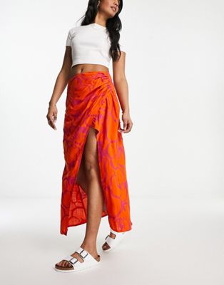 ASOS DESIGN natural slub ruched side midi skirt in orange fruit print