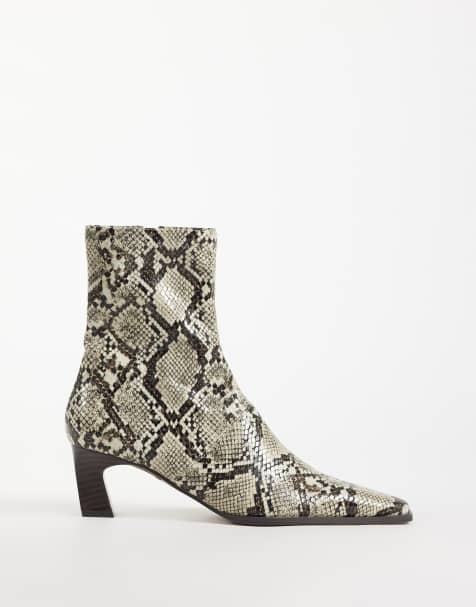 ASOS DESIGN Rudy chisel toe heeled sock boots in snake print - view 1