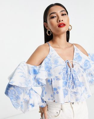 ASOS DESIGN ruffle blouse with lace up back in blue floral