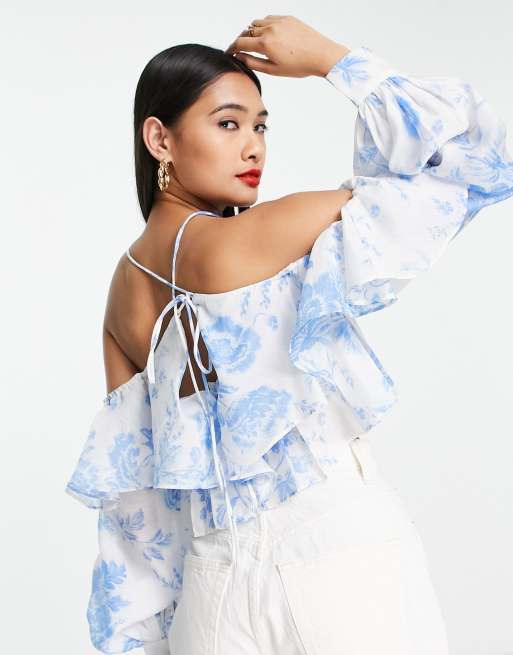 ASOS DESIGN ruffle blouse with lace up back in blue floral