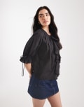 [ASOS DESIGN] ASOS DESIGN ruffle front top with pleat detail and tie front in black 4 Black