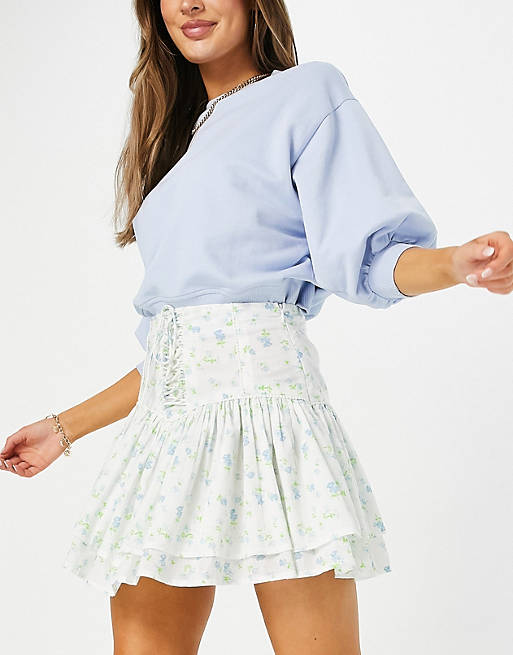 Skirts ruffle mini skirt with lace up detail in floral print 