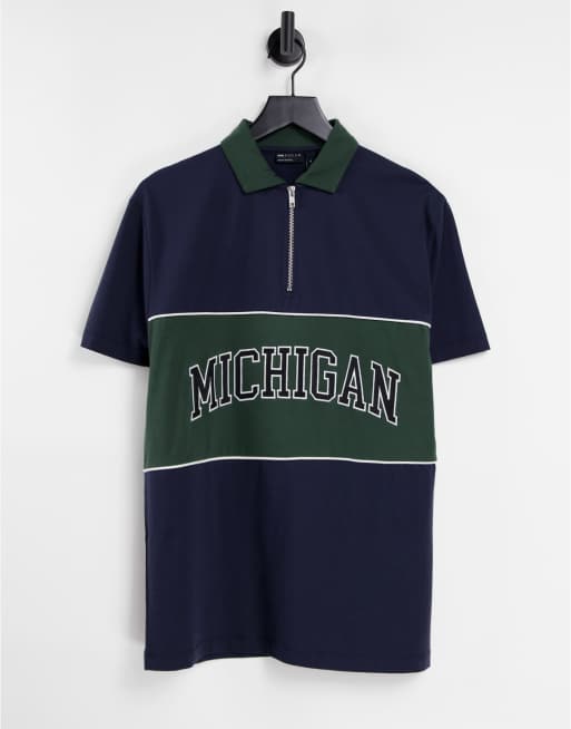 ASOS DESIGN - Ruimvallend poloshirt met 'Michigan'-print en kleurvlakken in marineblauw en groen 